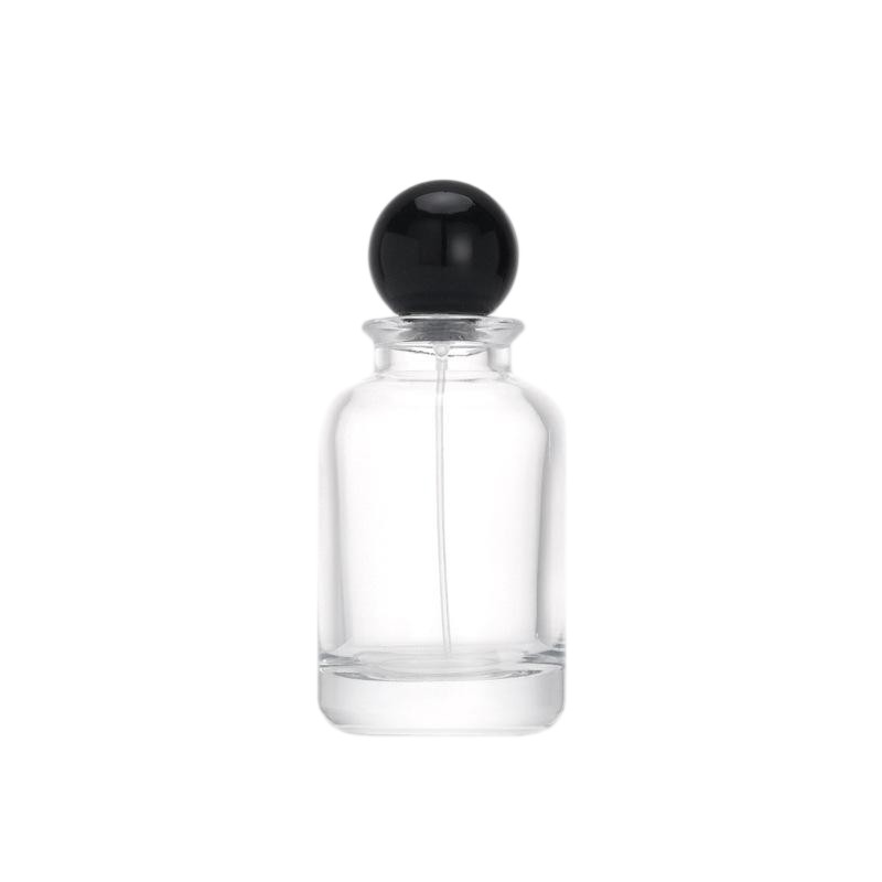 Cylindrical 100ml Crystal White Glass Perfume Bottle with Glossy Black Spherical Cap